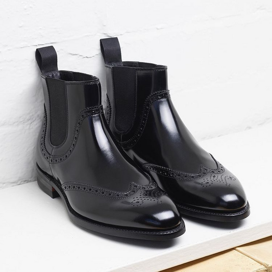 Black leather brogue boots